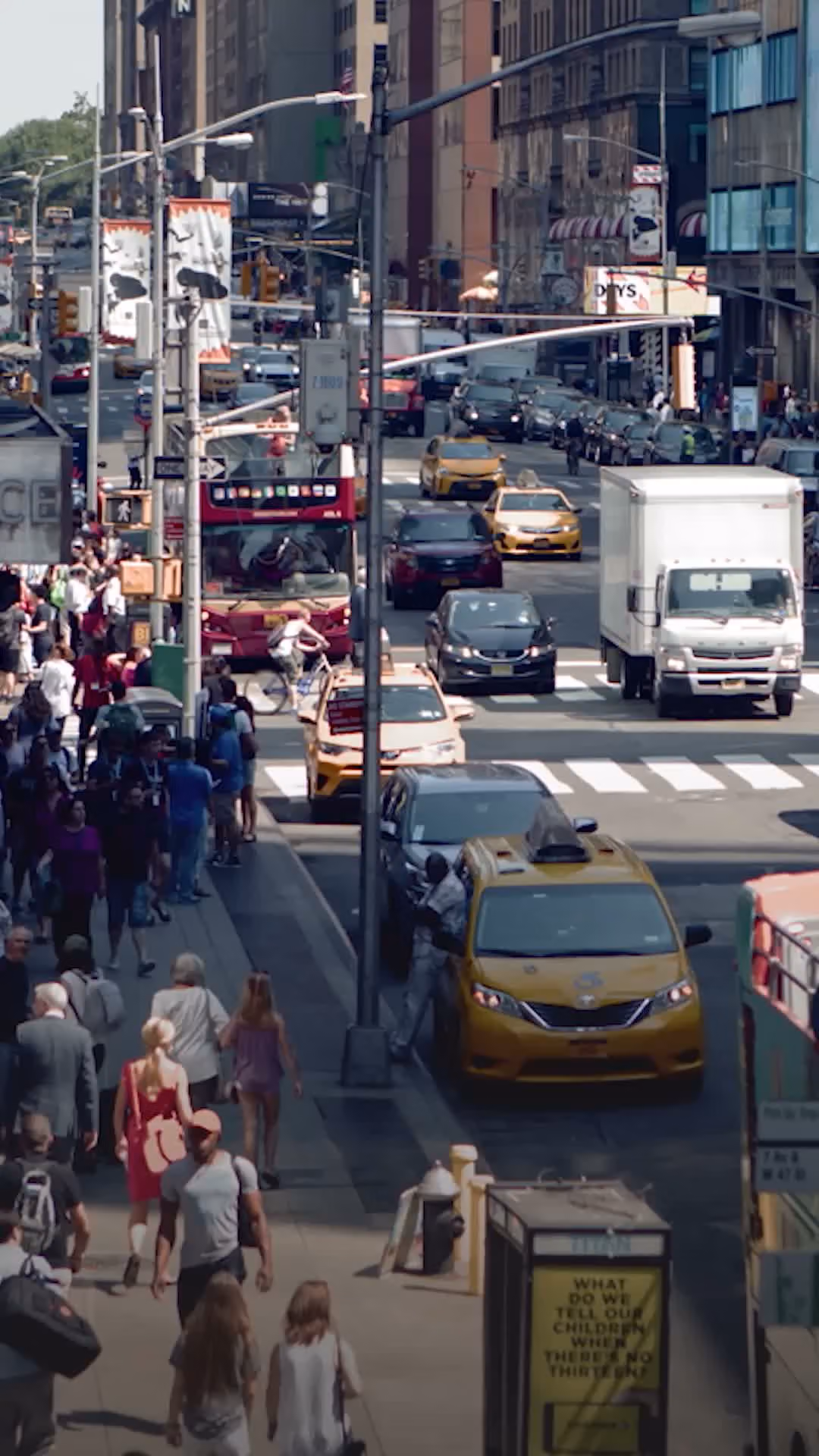 Busy New York City street with pedestrians and taxis